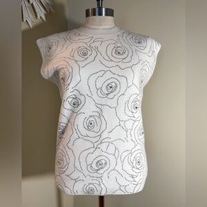 On twelfth white sleeveless roses sweater top with rhinestone L